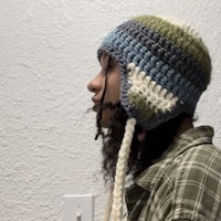 a woman wearing a crocheted hat